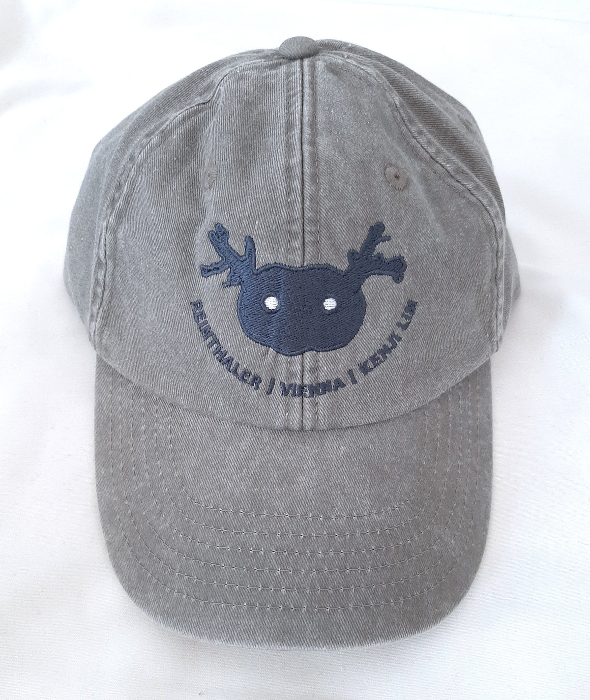 Kenji Lim vintage grey cap with embroidered Wide Eyed Half Light motif